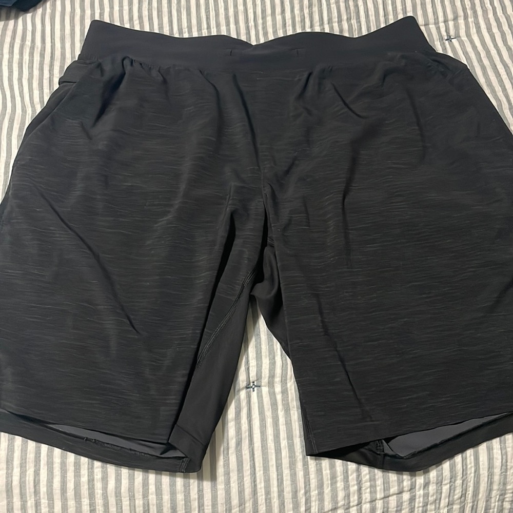 Lululemon.  THE shorts. Black with heather gray.